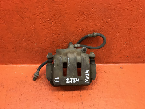 Суппорт тормозной передний левый NISSAN CEDRIC Y34