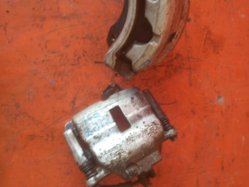 Суппорт тормозной передний левый NISSAN PRIMERA *P11 410112F021