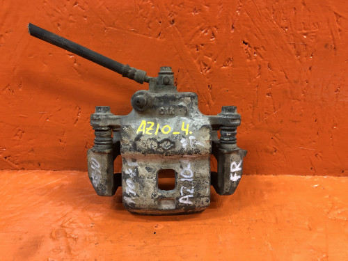 Суппорт тормозной передний правый NISSAN CUBE Z10