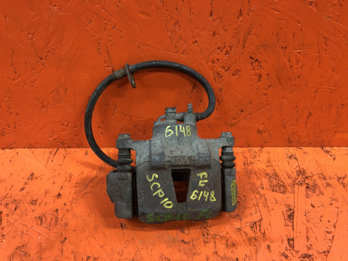 Суппорт тормозной передний левый TOYOTA BB NCP3*