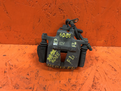 Суппорт тормозной передний левый TOYOTA BB NCP3*