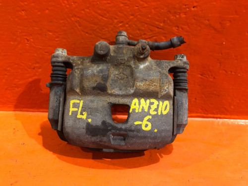 Суппорт тормозной передний левый NISSAN AD Y11 41011WD201